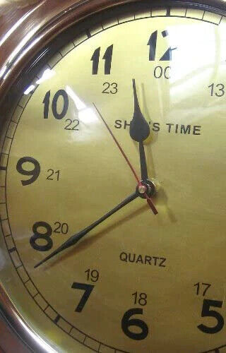 Reloj macizo en forma de ojo de buey - latón - diámetro 29 cm