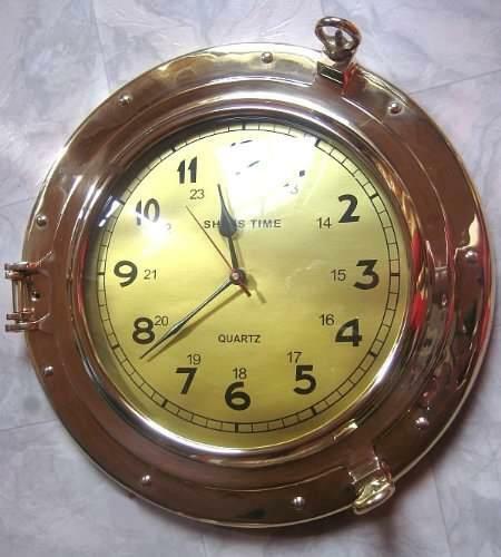 Reloj macizo en forma de ojo de buey - latón - diámetro 29 cm